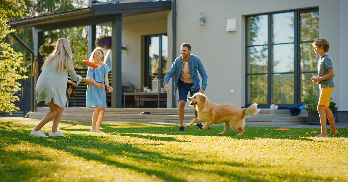 A family playing with a frisbee outdoors